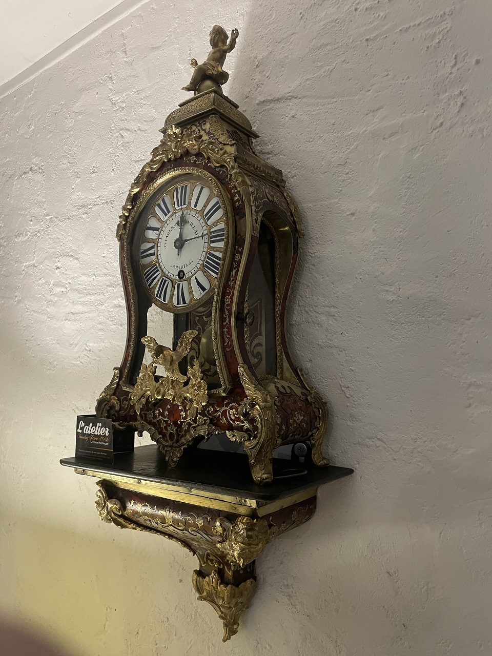 Restauration de dorure et de marqueterie sur un Cartel, Après